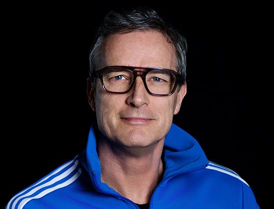 Profile picture of DJ Arlo in a blue tracksuit top