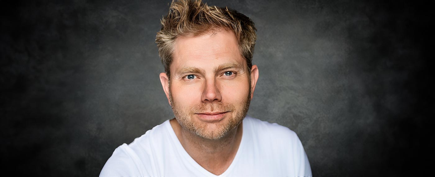 picture of the DJ Silvan Stoet wearing white t-shirt and looking into camera
